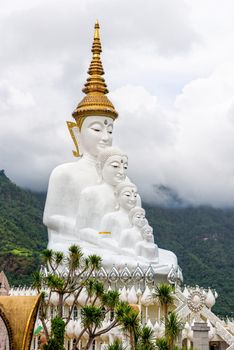 Buddha statue has large white five body on mountain surrounded by nature with cloud fog cover at Wat Phra That Pha Sorn Kaew Temple is a tourist attractions in Khao Kho, Phetchabun, Thailand