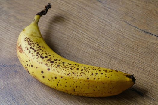 Close-up on a yellow banana on the table