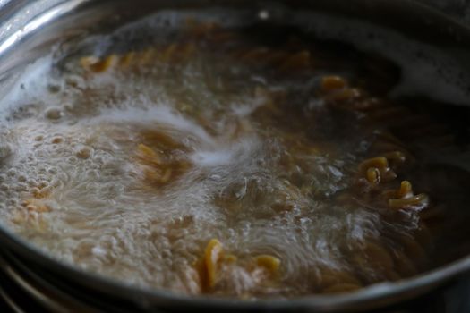 Out of focus. Boil pasta in boiling water