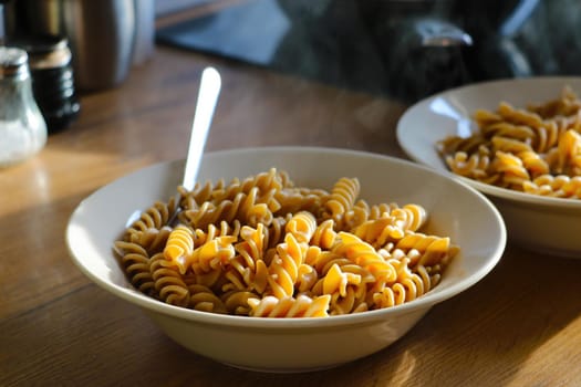 Hot boiled pasta in a plate. Healthy tasty food