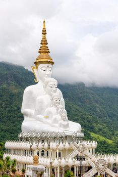 Buddha statue has large white five body on mountain surrounded by nature with cloud fog cover at Wat Phra That Pha Sorn Kaew Temple is a tourist attractions in Khao Kho, Phetchabun, Thailand