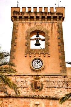 Tower and belfry of the Fortress castle of the fishing village of Santa Pola, Alicante, Spain