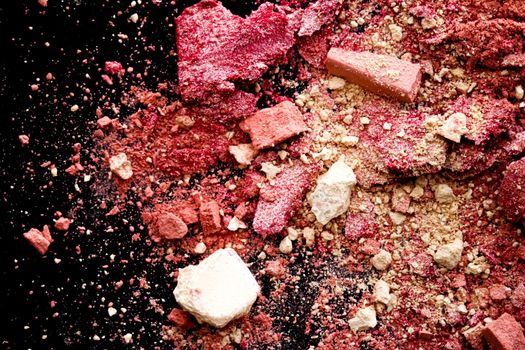 Crushed cosmetics, mineral organic eyeshadow, blush and cosmetic powder isolated on black background, makeup and beauty banner, flatlay design.