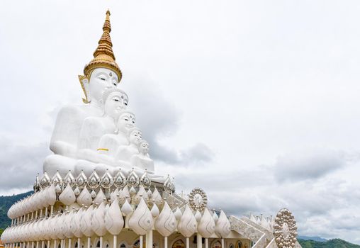 Buddha statue has large white five body on mountain surrounded by nature with cloud fog cover at Wat Phra That Pha Sorn Kaew Temple is a tourist attractions in Khao Kho, Phetchabun, Thailand