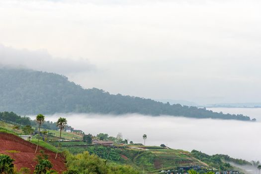 Beautiful nature landscape fog in the valley and the green mountain at the high angle viewpoint. Famous tourist attractions at Khao Kho district, Phetchabun province Thailand