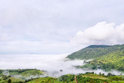 Beautiful nature landscape fog in the valley and the green mountain at the high angle viewpoint. Famous tourist attractions at Khao Kho district, Phetchabun province Thailand