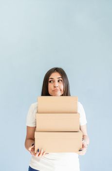 Zero waste, plastic free. Craft boxes in woman hands. Beautiful smiling woman holding blank boxes. Mock up design