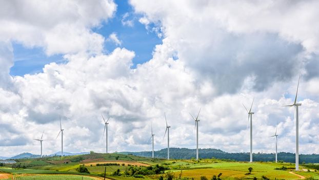 Beautiful nature landscape windmills field on the hill and blue sky, white clouds are the background at Khao Kho, Phetchabun Province, Thailand, 16:9 wide screen