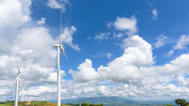 Landscape many wind turbine field on blue sky and clouds background, clean energy help reduce global warming at Khao Kho, Phetchabun, Thailand, 16:9 wide screen