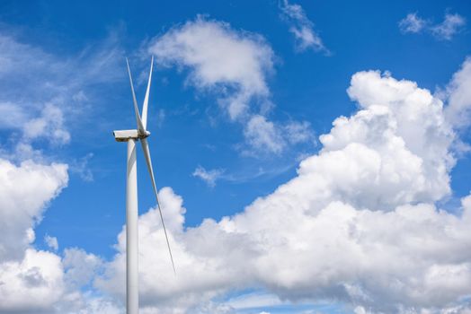 Beautiful windmill on blue sky and white clouds background, Clean energy eco-friendly electric power source help reduce global warming