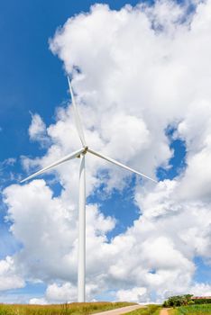 Beautiful one windmill on the hill with blue sky and white clouds background, Clean energy eco-friendly electric power source help reduce global warming