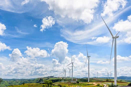 Beautiful nature landscape many windmills field on the hill with blue sky and clouds background, clean energy eco-friendly electric power at Khao Kho, Phetchabun, Thailand