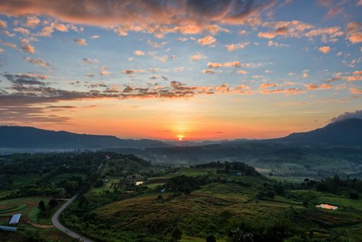 Beautiful nature landscape of the colorful sky and mountains during the sunrise at Khao Takhian Ngo View Point, Khao Kho attractions in Phetchabun, Thailand