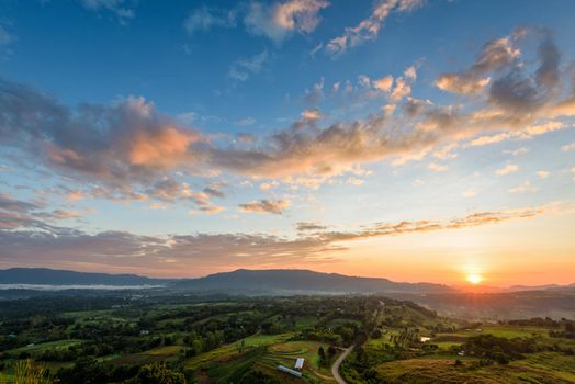 Beautiful nature landscape of the colorful sky and mountains during the sunrise at Khao Takhian Ngo View Point, Khao Kho attractions in Phetchabun, Thailand