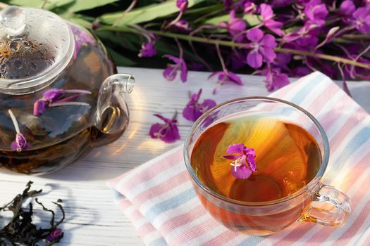 Herbal tea made from fireweed known as blooming sally in teapot and cup.