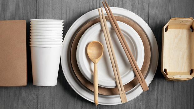 Eco friendly packaging and dishes made from natural recyclable materials. Environmental protection and waste reduction concept, top view, flat lay.