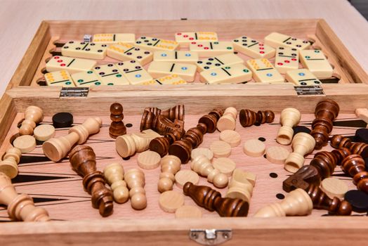 checkers, chess, dominoes and backgammon. set of board games