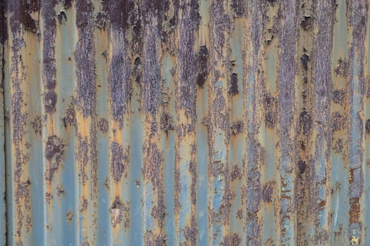 Texture painted rusted metal, colored background with iron fence. grunge green-yellow old dirty abstract Background.