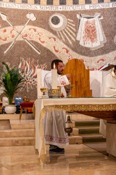 terni,italy may 21 2021:priests during the holy mass in the church of sacro cuore terni