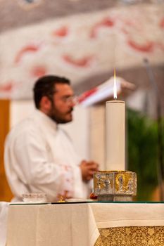 terni,italy may 21 2021:priests during the holy mass in the church of sacro cuore terni