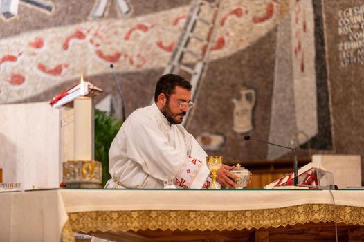 terni,italy may 21 2021:priests during the holy mass in the church of sacro cuore terni