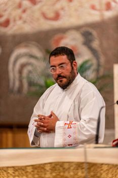 terni,italy may 21 2021:priests during the holy mass in the church of sacro cuore terni