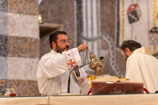 terni,italy may 21 2021:priests during the holy mass in the church of sacro cuore terni