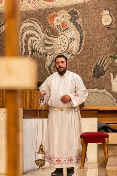 terni,italy may 21 2021:priests during the holy mass in the church of sacro cuore terni