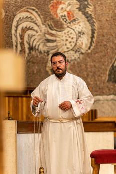 terni,italy may 21 2021:priests during the holy mass in the church of sacro cuore terni