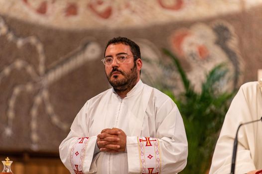 terni,italy may 21 2021:priests during the holy mass in the church of sacro cuore terni