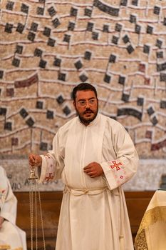 terni,italy may 21 2021:priests during the holy mass in the church of sacro cuore terni