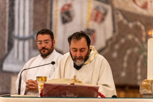 terni,italy may 21 2021:priests during the holy mass in the church of sacro cuore terni