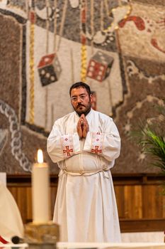 terni,italy may 21 2021:priests during the holy mass in the church of sacro cuore terni