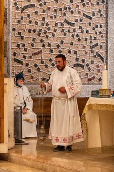 terni,italy may 21 2021:priests during the holy mass in the church of sacro cuore terni