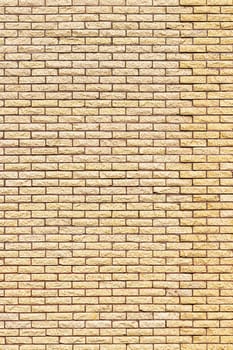 Yellow decorative brick wall texture. Abstract background for design.