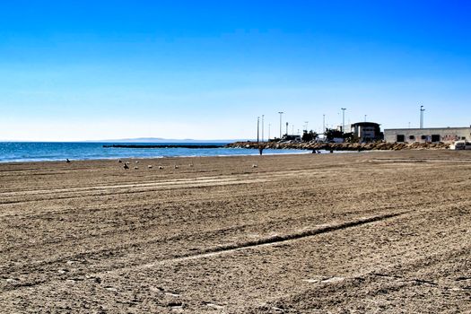 Sunny day on the beach in winter in Santa Pola, Alicante