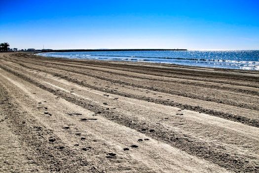Sunny day on the beach in winter in Santa Pola, Alicante