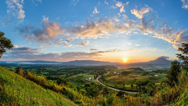 Panorama beautiful nature landscape of the colorful sky and mountains during the sunrise at Khao Takhian Ngo View Point, Khao Kho attractions in Phetchabun, Thailand