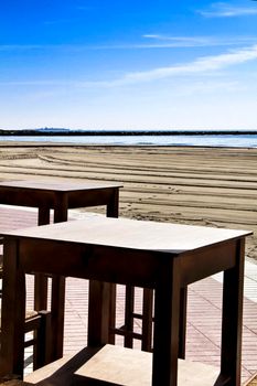 Bar with empty terrace on Santa Pola beach on a sunny day