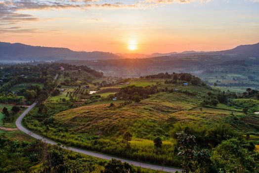 Beautiful nature landscape of the colorful sky and mountains during the sunrise at Khao Takhian Ngo View Point, Khao Kho attractions in Phetchabun, Thailand