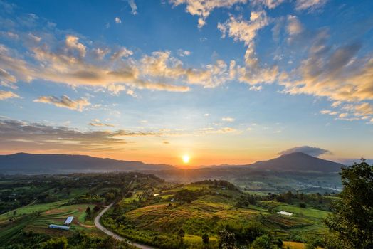 Beautiful nature landscape of the colorful sky and mountains during the sunrise at Khao Takhian Ngo View Point, Khao Kho attractions in Phetchabun, Thailand