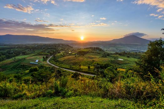 Beautiful nature landscape of the colorful sky and mountains during the sunrise at Khao Takhian Ngo View Point, Khao Kho attractions in Phetchabun, Thailand