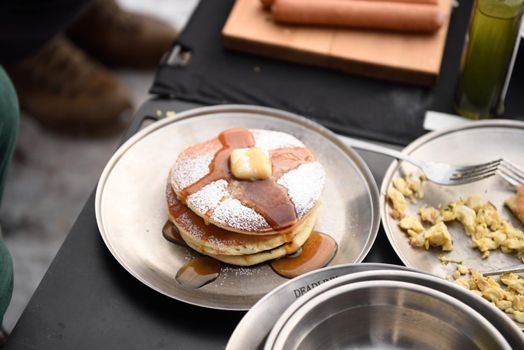 Pancakes with butter and warm maple syrup