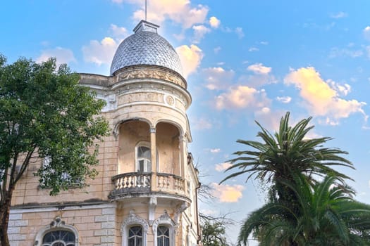 Urban landscape with ancient architecture and palm trees. Sukhumi, Abkhazia