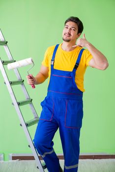 Young painter doing renovation at home 