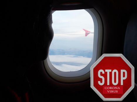 Passanger silhouette watching from plane China country with Corona virus alert sign. Escape from infected country. 