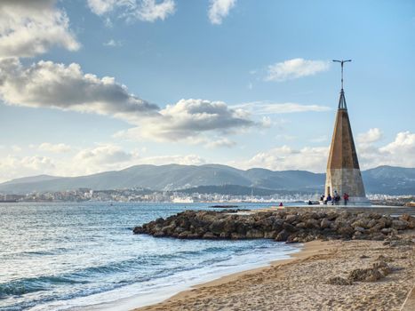 Seagull monument with blue shinning peak. Well known meeting place at seaside promenade. Palma city, Mallorka island, Spain. 26th of January 2020