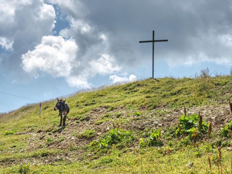 Peak of mountain with cross for memory to victims. Manrvelous day in summer
