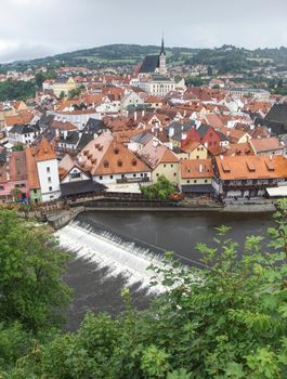 Tower of castle and rooftops in old town of Cesky Krumlov.  14th of July 2019 Cesky Krumlov Castle in Cesky Krumlov town, Czech Republic.  