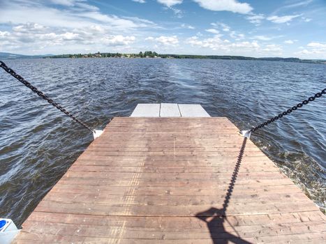 Shipping on Ferry Boat Ship with open Ramp and empty Car Deck. Wooden board for cars and passenger